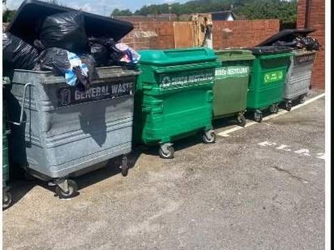After: Row of general waste and recycling bins