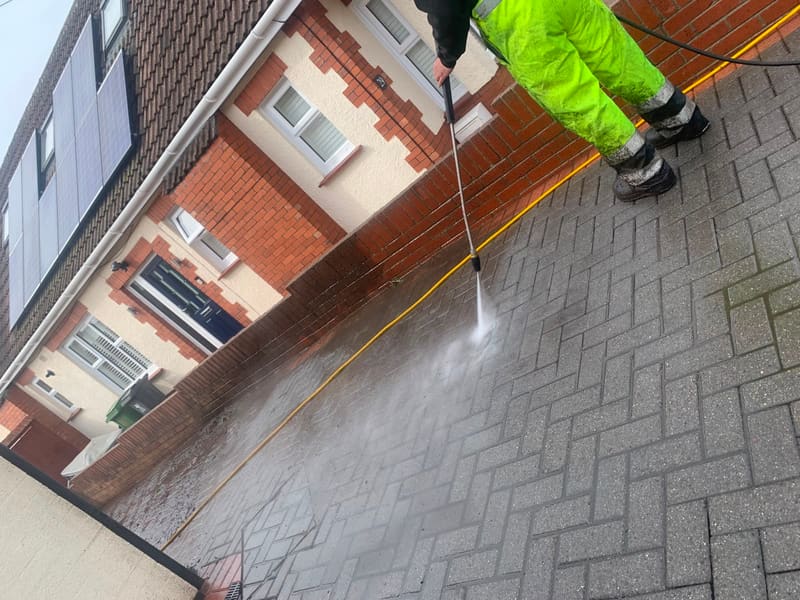 Pressure washing a block paved driveway