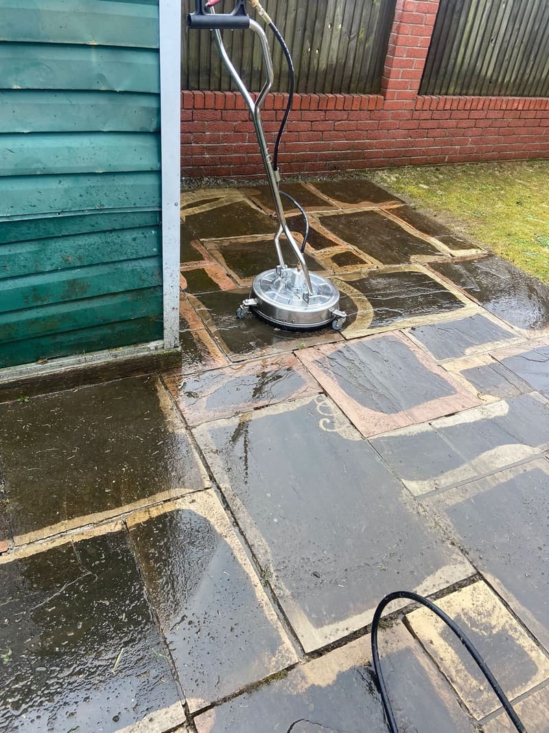 Cleaning a stone patio with a flat surface cleaner
