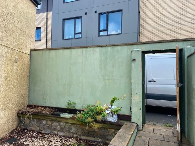 Green painted wall and garden gate