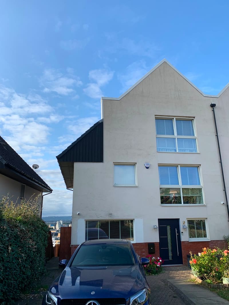 Modern three-storey rendered house after exterior cleaning