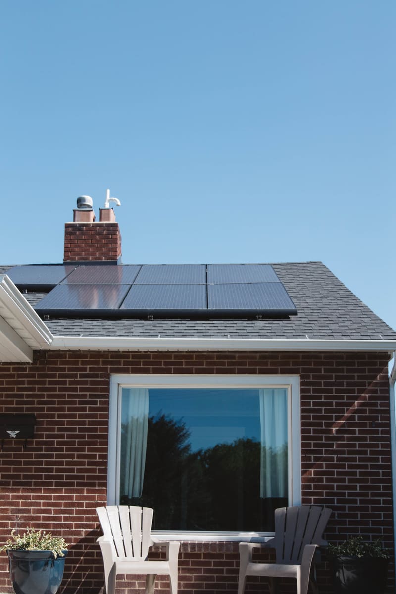 Solar panels on a residential brick house roof